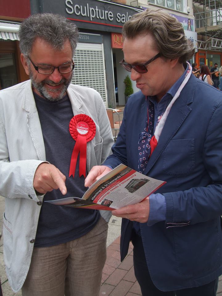 Peter Chowney with Warren Davies, discussing an election manifesto in the street